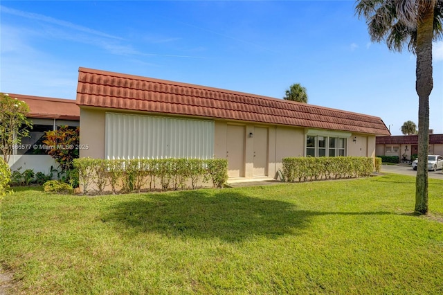 view of front of home with a front yard