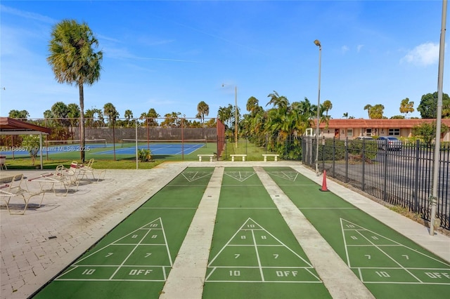 surrounding community featuring tennis court