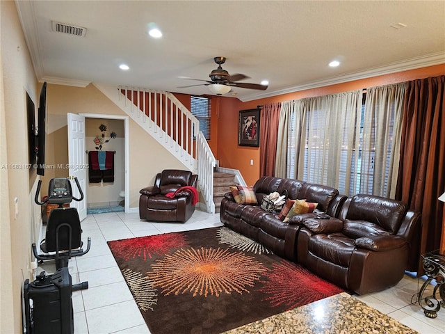 tiled living room featuring ceiling fan and ornamental molding