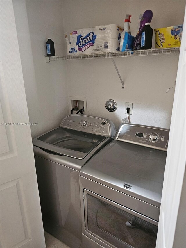 laundry room featuring separate washer and dryer