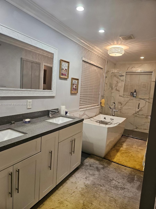 bathroom with ornamental molding, vanity, and plus walk in shower