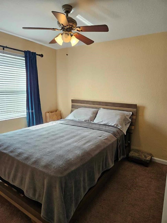 carpeted bedroom featuring ceiling fan