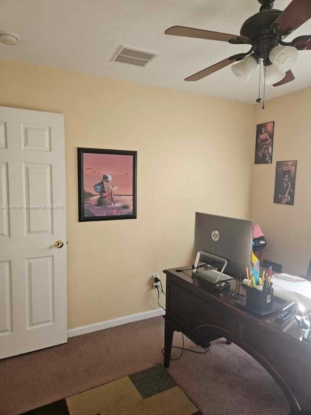 carpeted office featuring ceiling fan