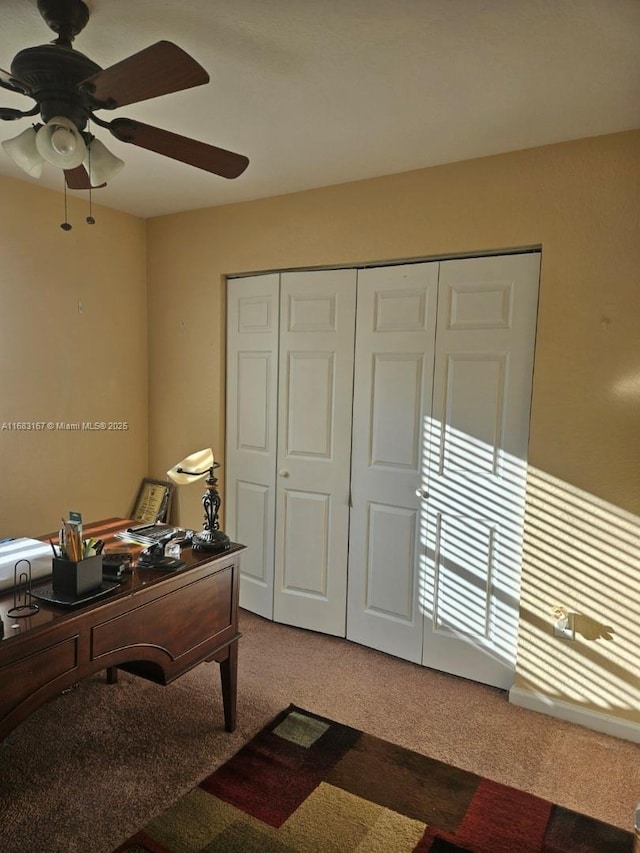 office space featuring carpet floors and ceiling fan