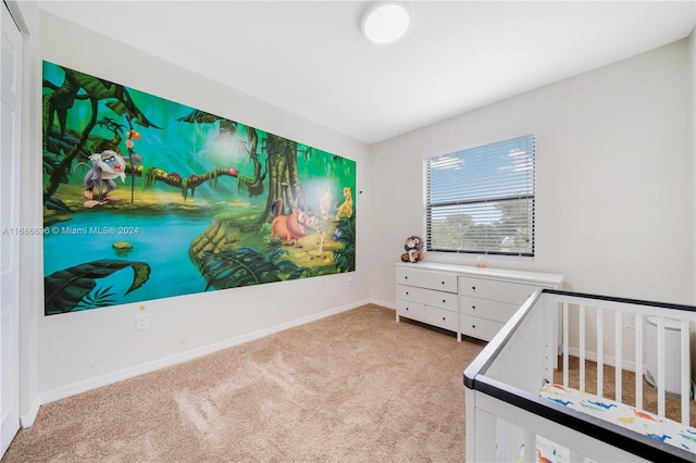 carpeted bedroom with a crib