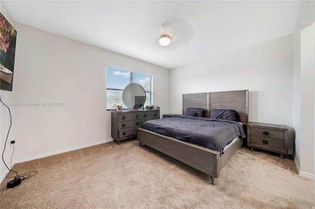 bedroom featuring light carpet and ceiling fan