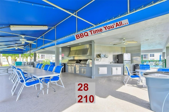 view of patio featuring a grill, area for grilling, and ceiling fan