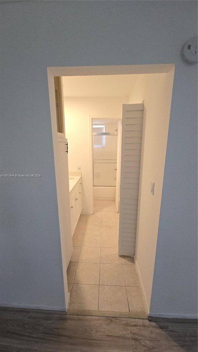 hallway with light tile patterned floors