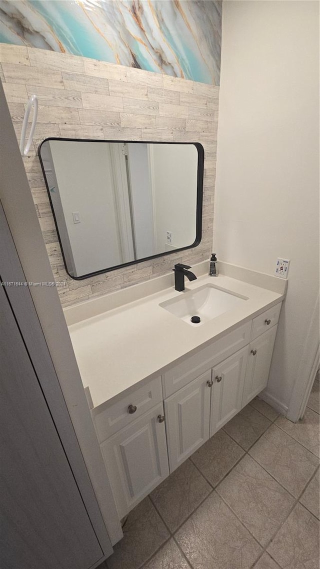 bathroom featuring vanity and tile patterned flooring