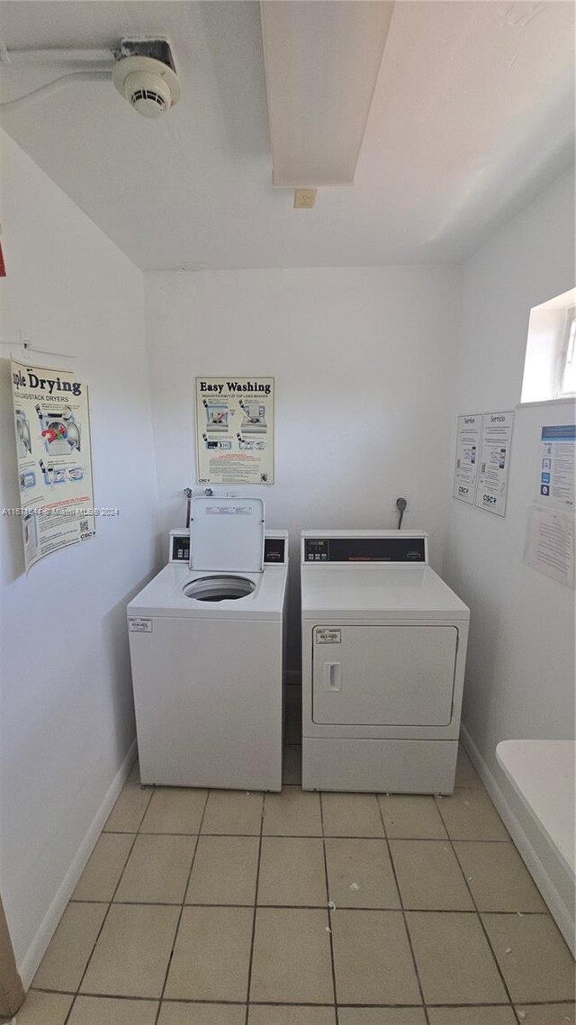 laundry area featuring light tile patterned floors