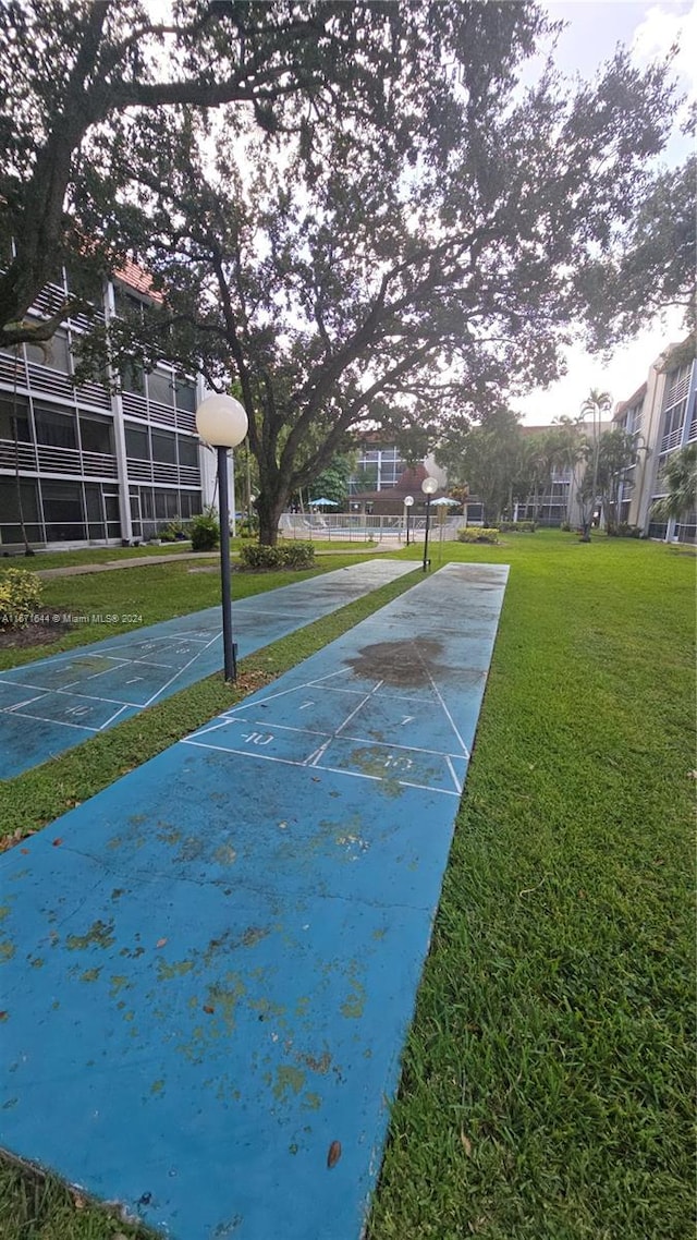 view of home's community featuring a yard