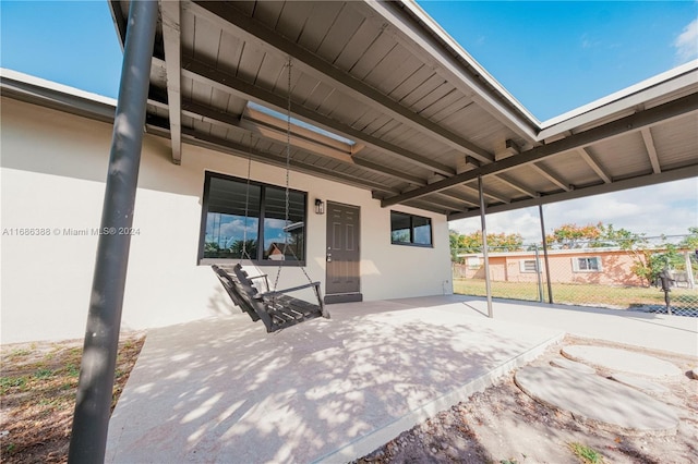 view of patio / terrace featuring a carport