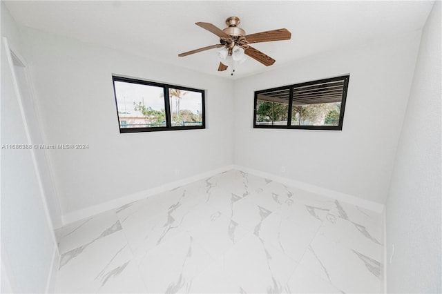 unfurnished room featuring ceiling fan