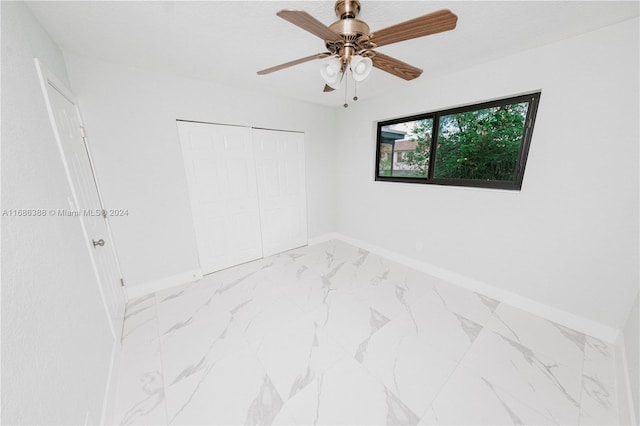 unfurnished room with ceiling fan