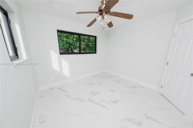 unfurnished room featuring ceiling fan