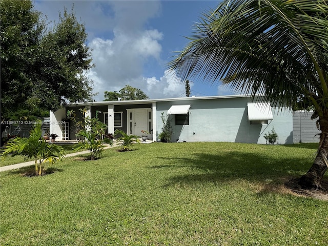 view of front of property with a front lawn