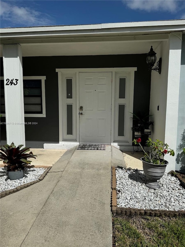 entrance to property with covered porch