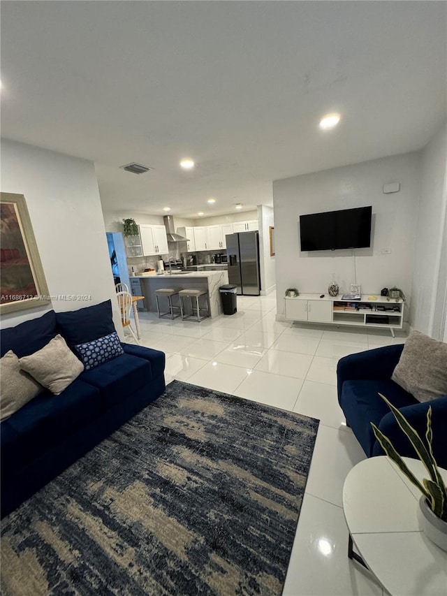 living room featuring light tile patterned flooring