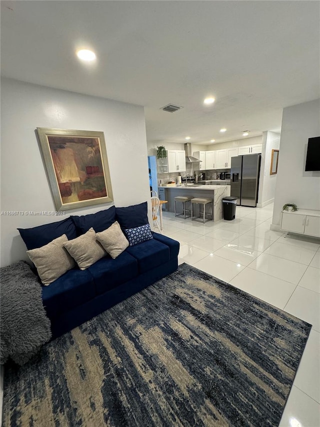 living room with light tile patterned floors