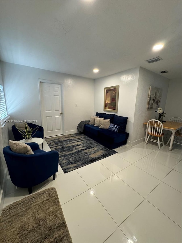 living room with tile patterned floors