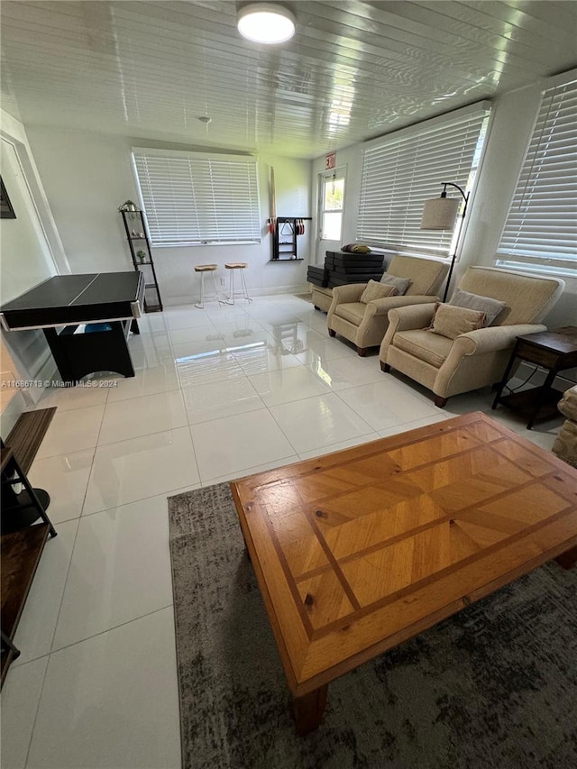 living room with tile patterned floors