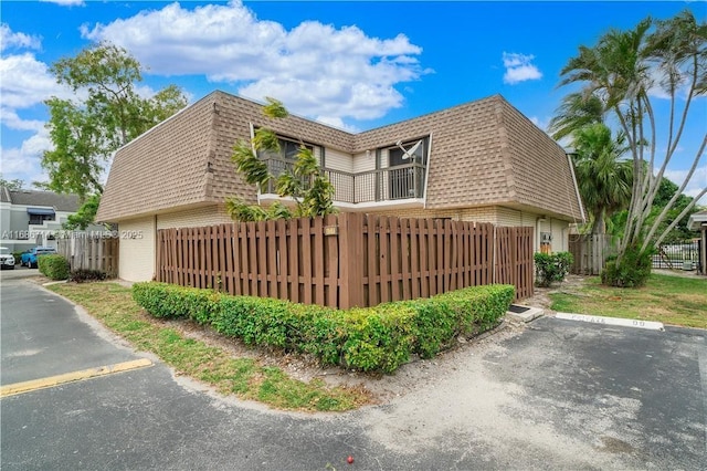 view of property exterior featuring a balcony