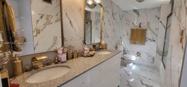 bathroom with walk in shower, vanity, toilet, and tile walls