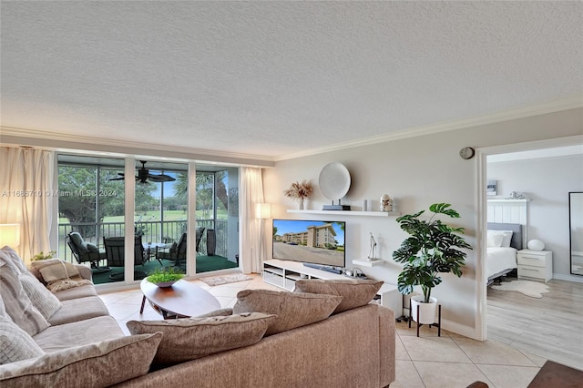 tiled living room with crown molding and a textured ceiling