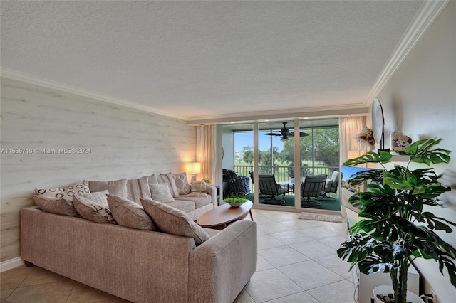 living room featuring crown molding, light tile patterned flooring, and a textured ceiling