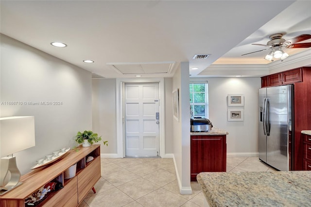 tiled entryway with ceiling fan