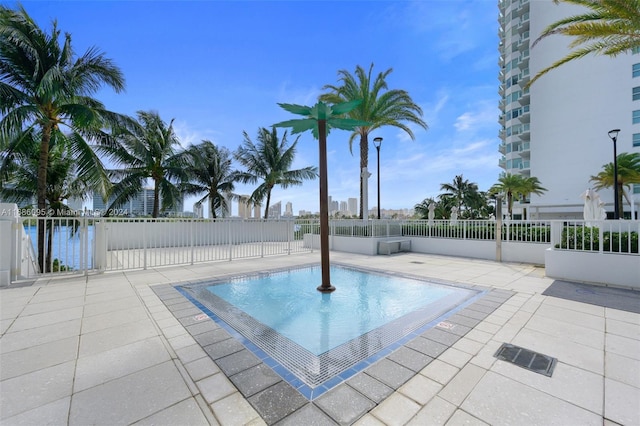 view of swimming pool featuring a patio