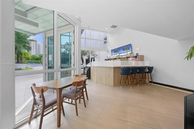 dining space featuring floor to ceiling windows