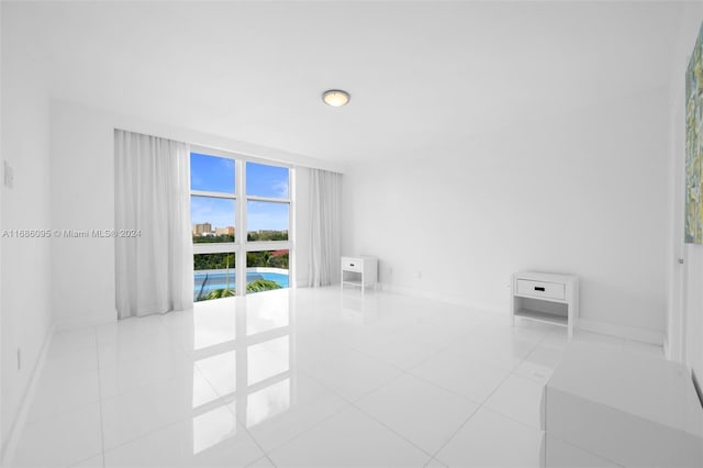 unfurnished room featuring light tile patterned floors