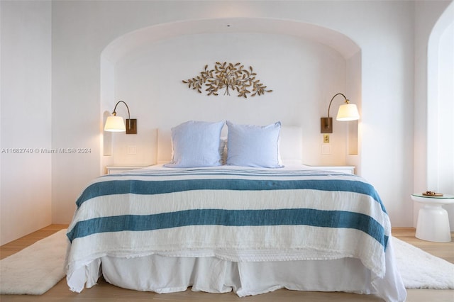 bedroom featuring wood-type flooring