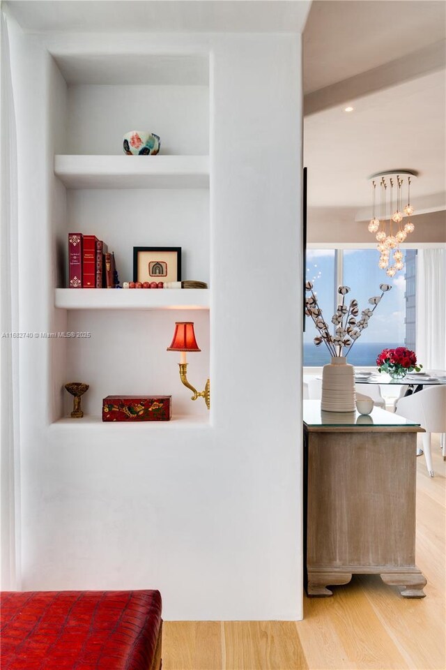 1425 Brickell Ave Unit 55F, Miami, FL 33131 - detailed view of wood finished floors and a chandelier