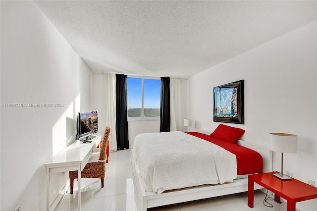 bedroom featuring a textured ceiling