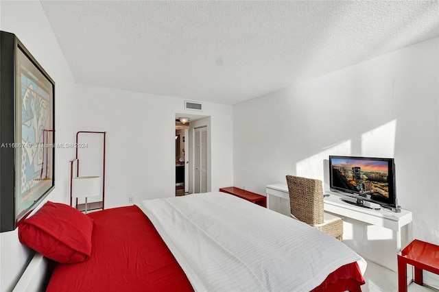 bedroom with a textured ceiling