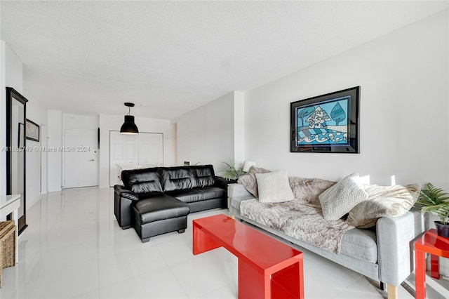 living room featuring a textured ceiling