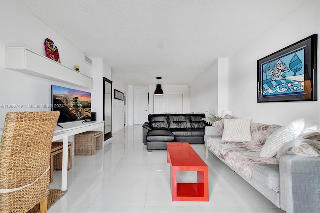 living room with a textured ceiling