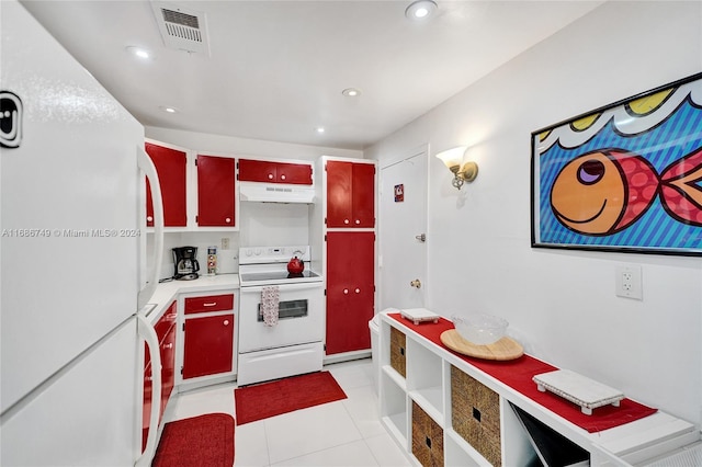 kitchen with light tile patterned flooring and white appliances