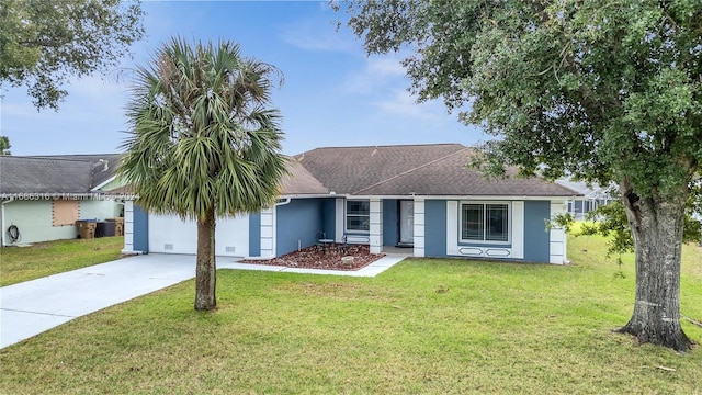 single story home with a front yard and a garage