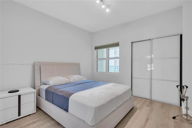 bedroom with light hardwood / wood-style flooring