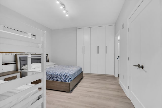 bedroom with light wood-type flooring