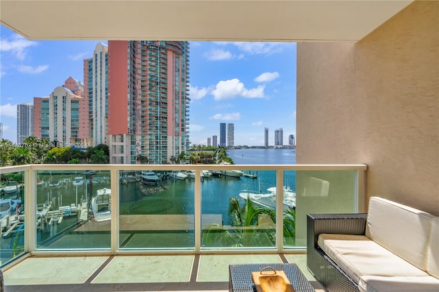 balcony featuring a water view