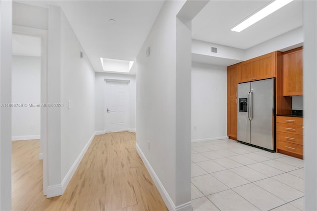 hallway featuring light hardwood / wood-style flooring