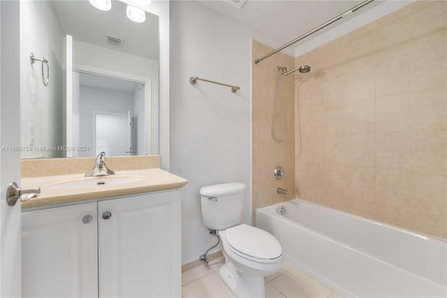 full bathroom with vanity, toilet, tile patterned flooring, and tiled shower / bath