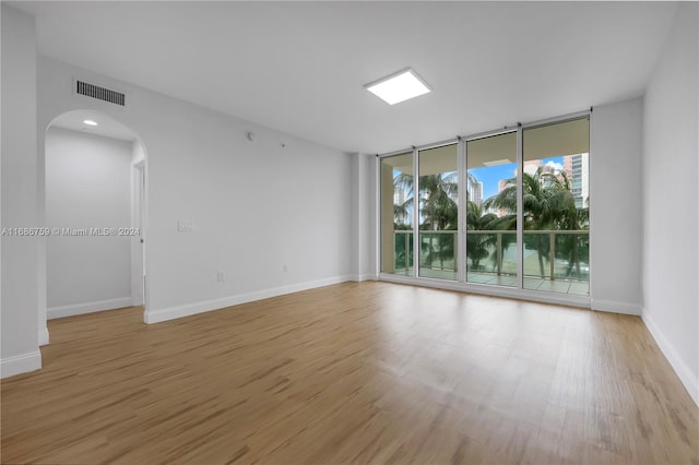 empty room with light hardwood / wood-style floors