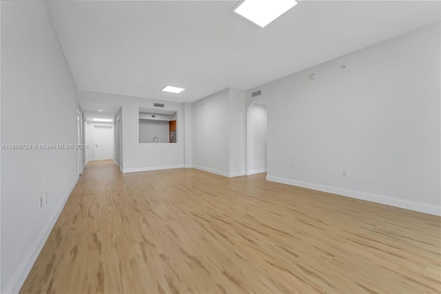 unfurnished living room with light wood-type flooring