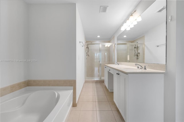 bathroom with vanity, plus walk in shower, and tile patterned flooring