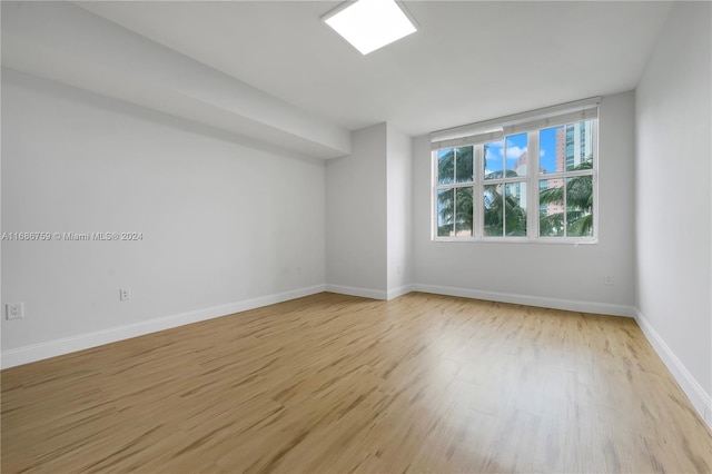 spare room with light wood-type flooring